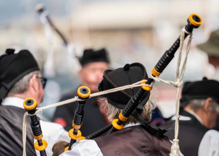 Bands Playing bagpipes in a at an event in Australia. Scottish h