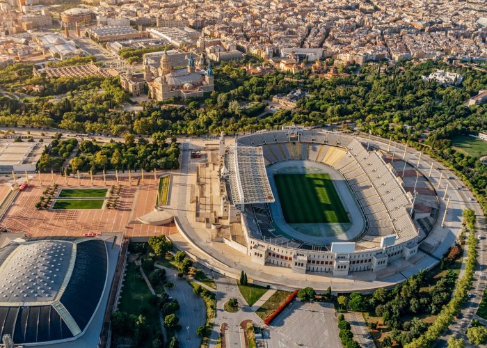 Aerial view of the Lluis Companys of Barcelona Olympic stadium. Cityscape from helicopter. top view, On the Montjuic mountain
